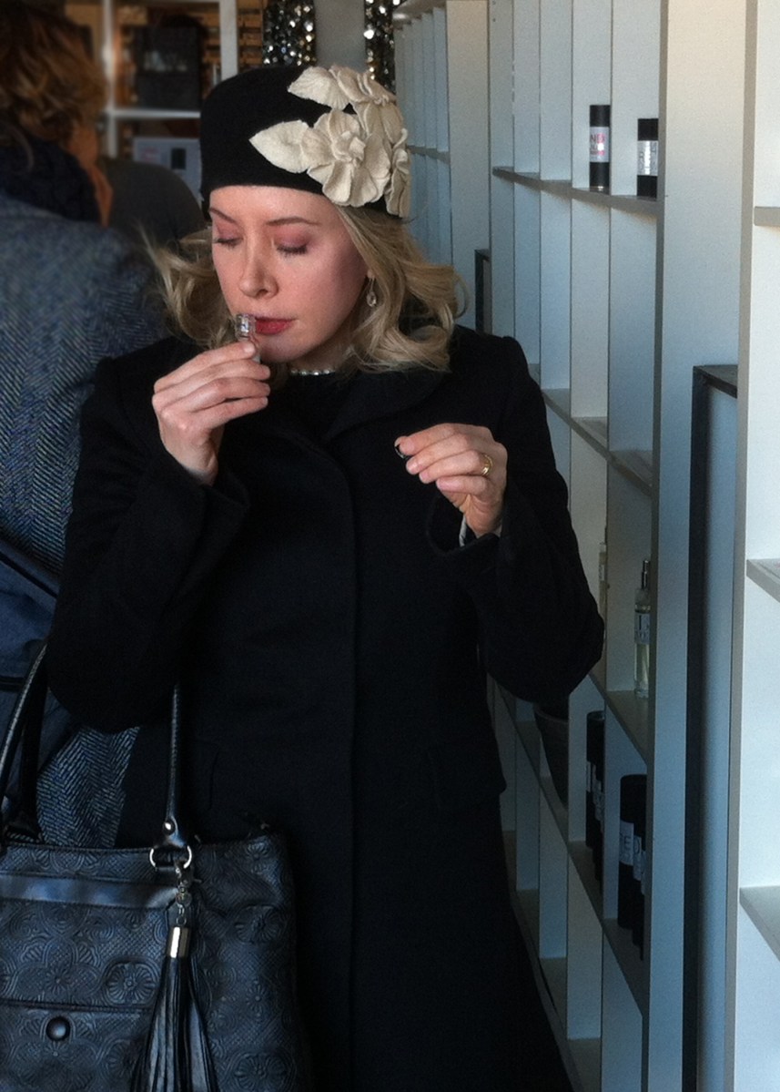 Kathleen Tessaro smelling perfume